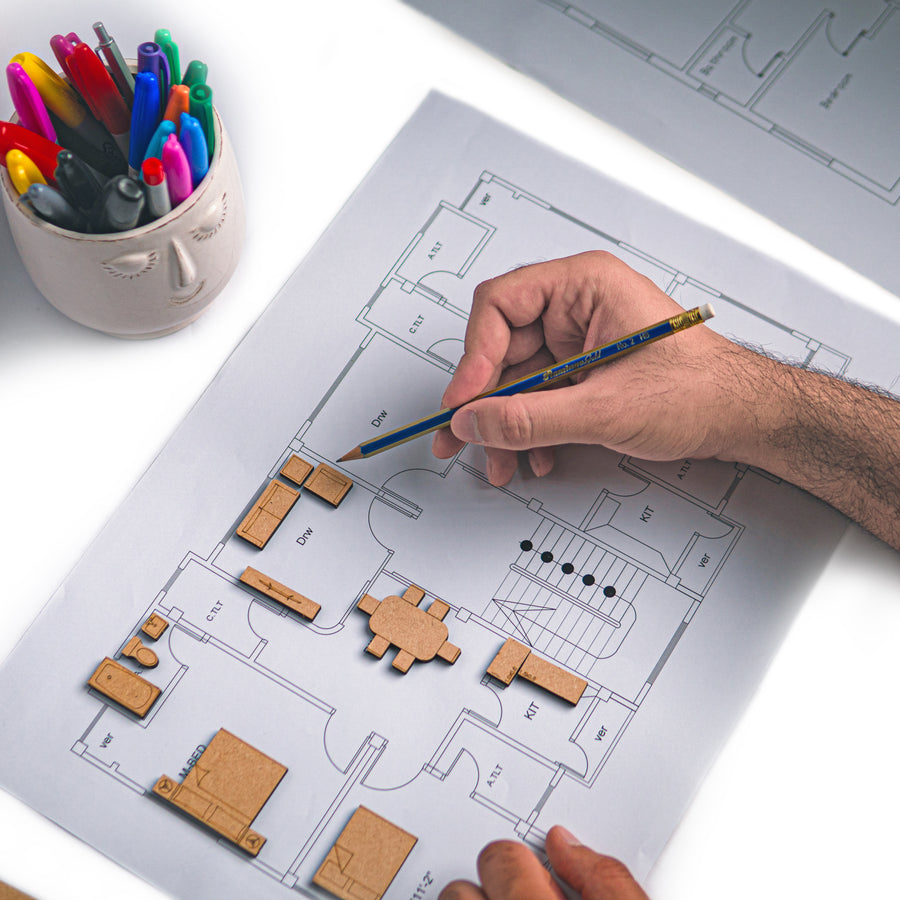 Kayan Blocks being placed on an architectural plan